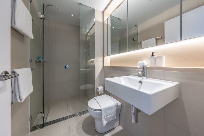 bathroom with toilet and shower